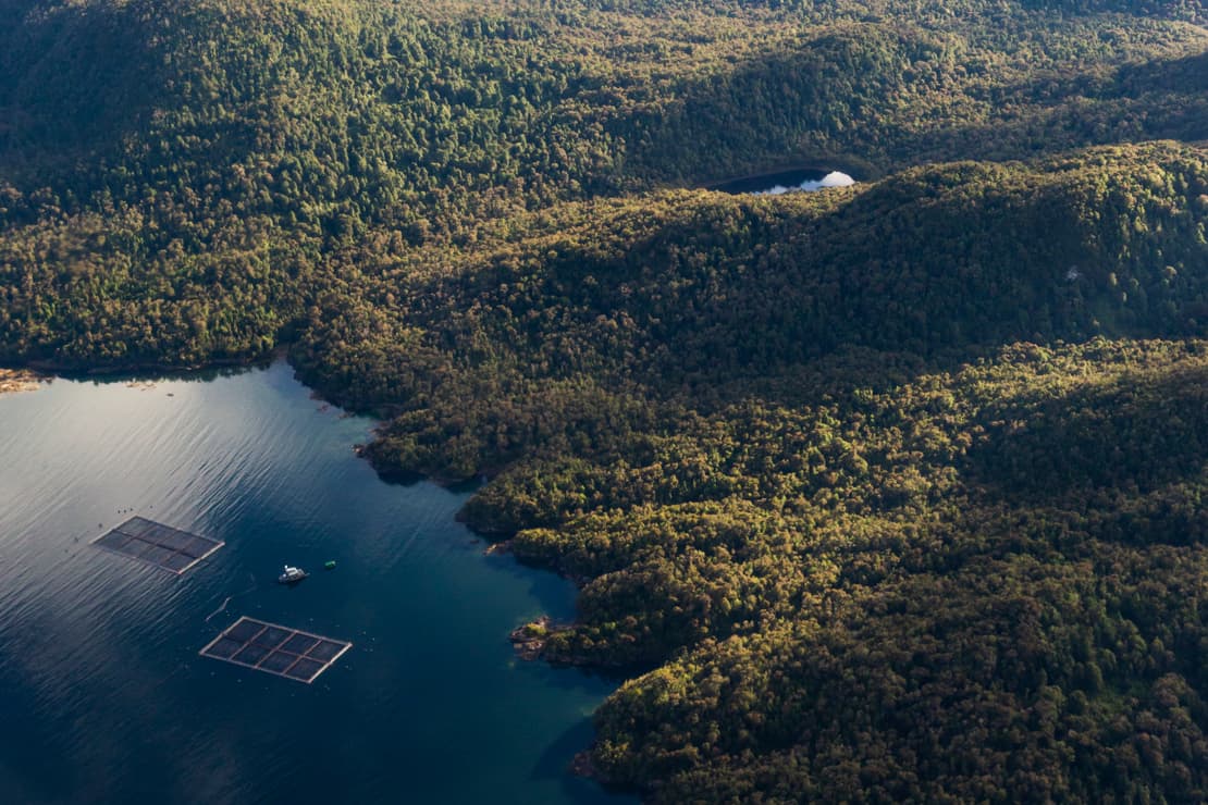 2 salmon farms with mountains, Chile